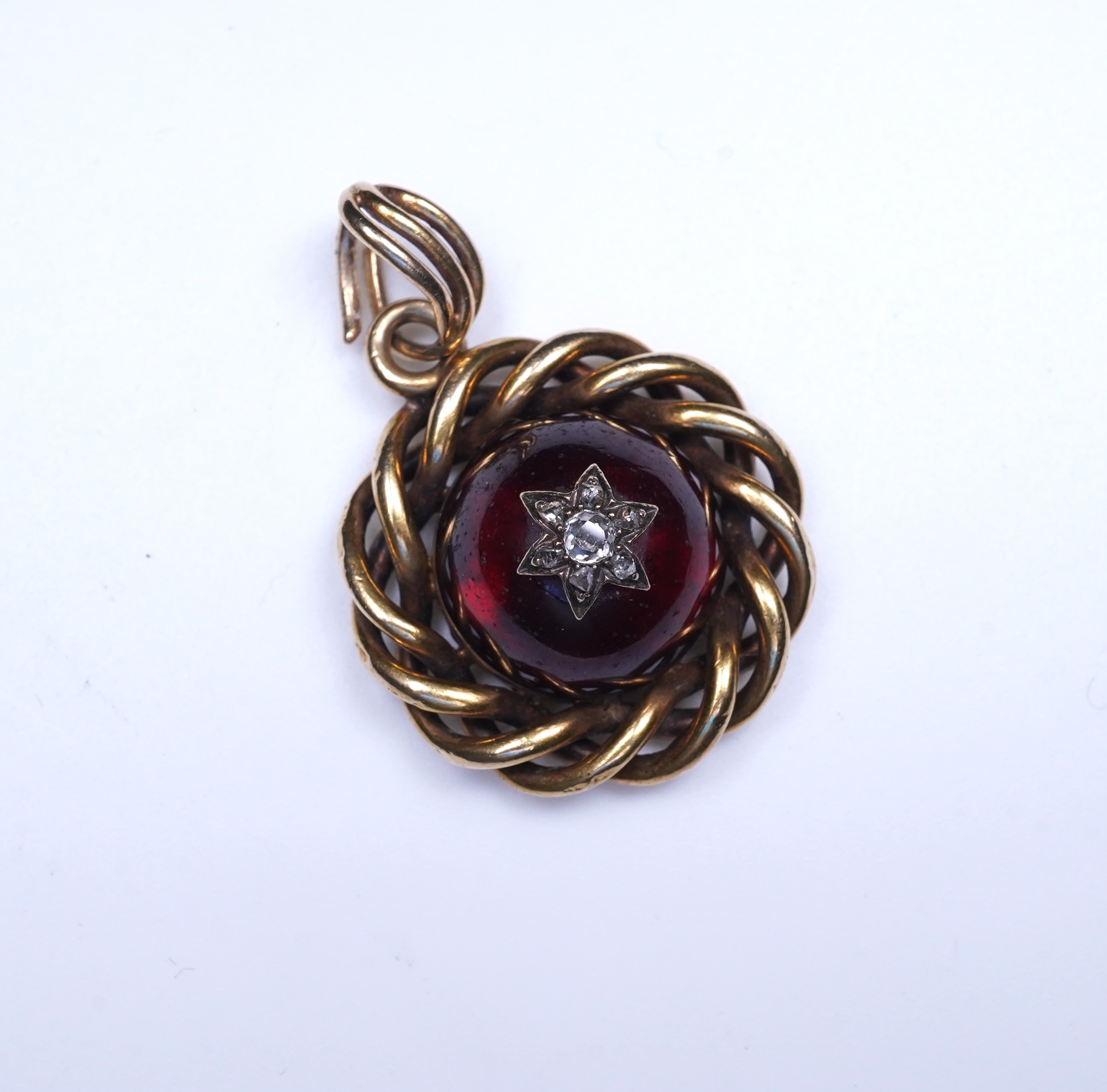 A Victorian garnet and diamond pendant, mid 19th century